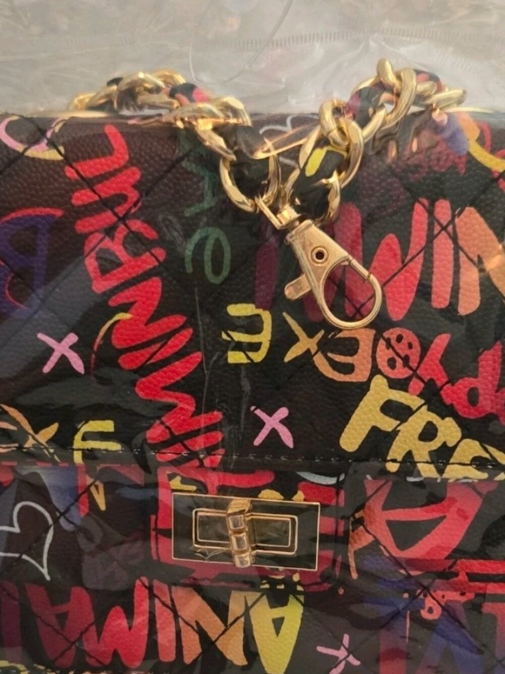 Graffiti print crossbody with metal chain strap